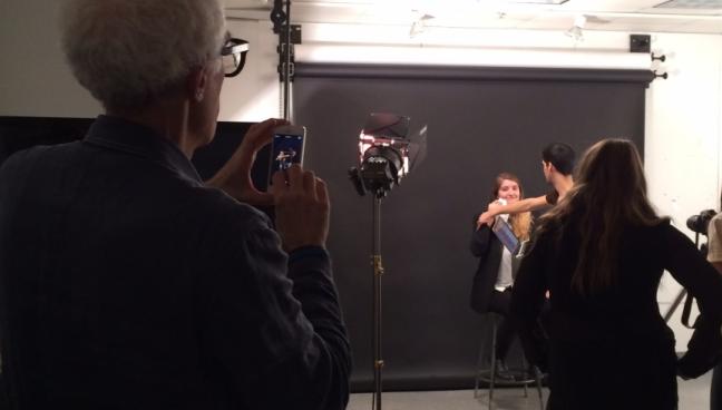 Students photographing a sneeze in a classroom.